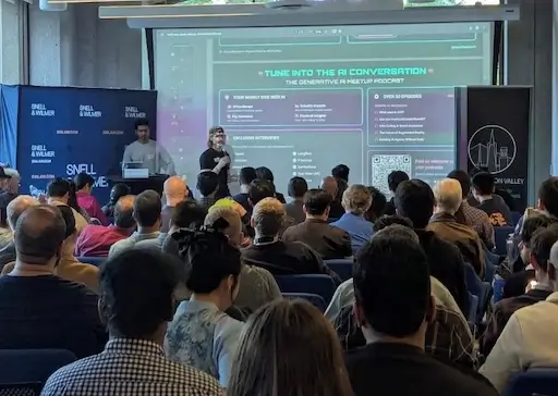 Speakers presenting at a packed AI talk